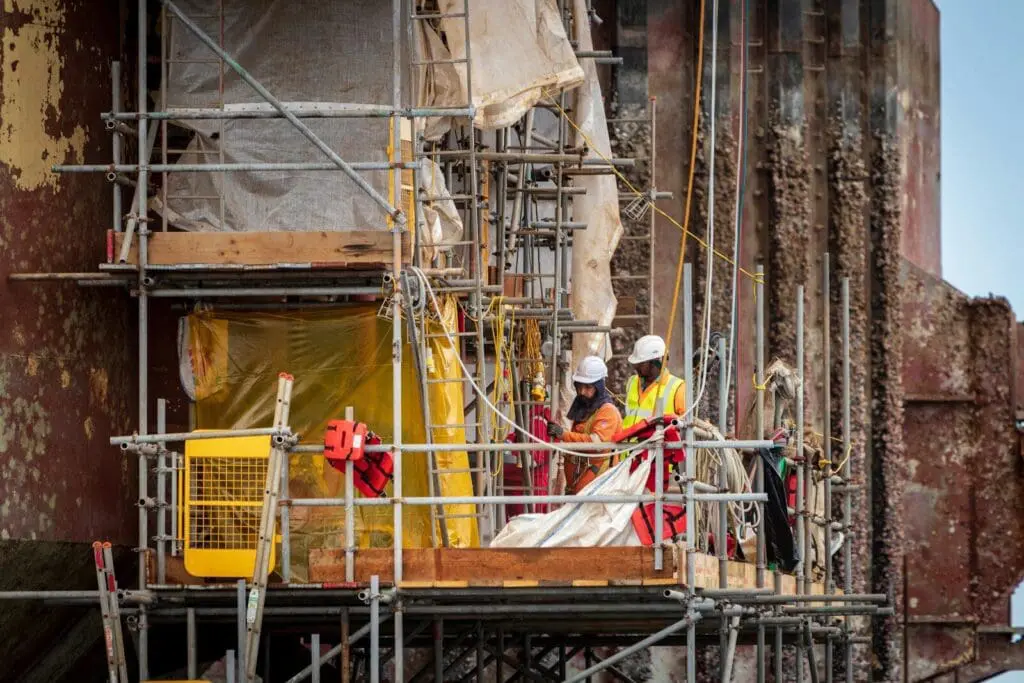 Men on scaffolding, construction risk, risk management and work health and safety risk
