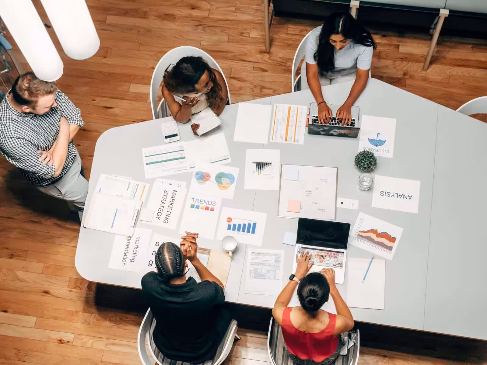 People in the Office Discussing Startup Key Takeaways. Blaze Business & Legal.