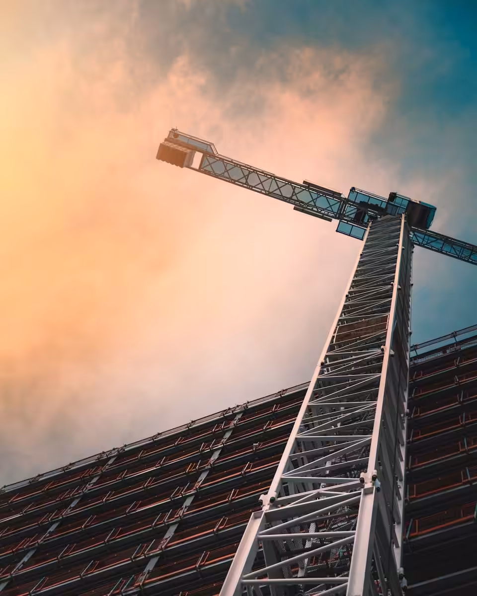 Grey tower crane on a construction site. Brisbane construction industry