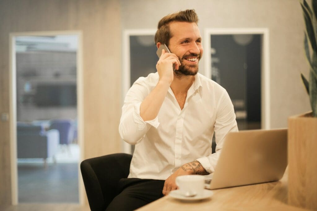 Man using smartphone on chair. Small Business Management Consultant. Business Management Consultant.