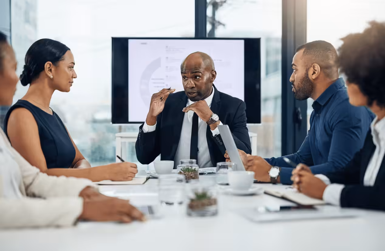 Man discusses his market research during a meeting. Business Growth Consultant. Services