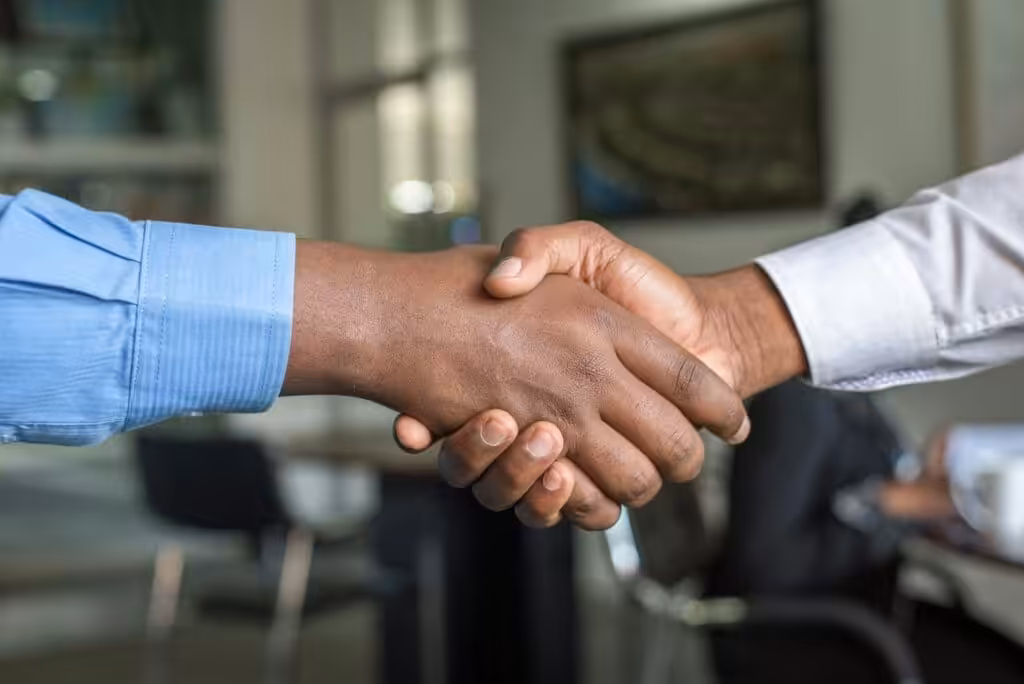 Two people shaking hands. How much does a Shareholders Agreement cost?