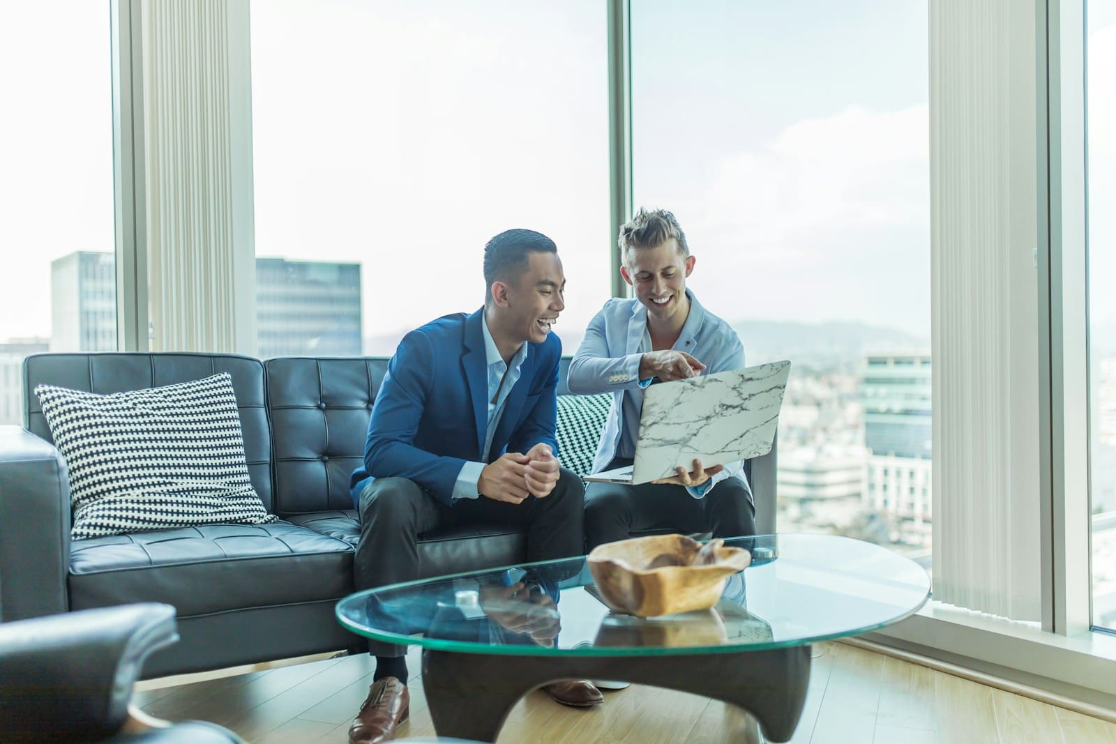 Services 2 Two businessmen in suit sitting on sofa. Blaze Business & Legal - How we help you. Services