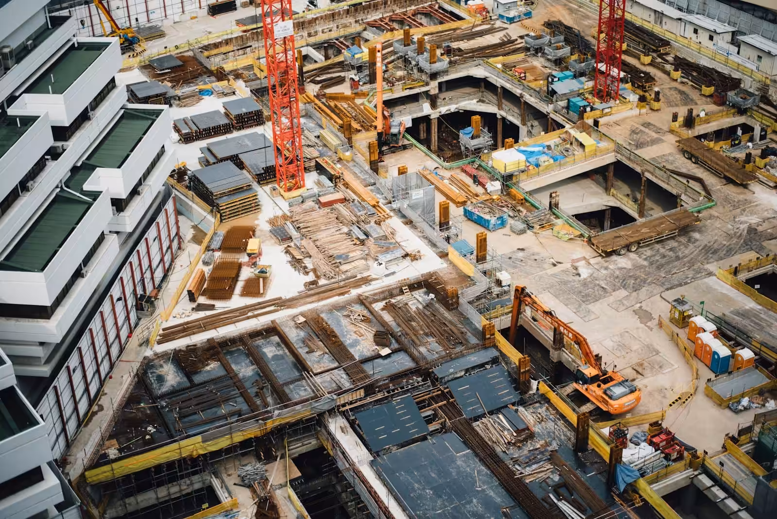 Aerial view of high-rise buildings. Indemnities, Insurances and Limits of Liability in Construction Contracts. Large Business. AS2124-1992. AS2124