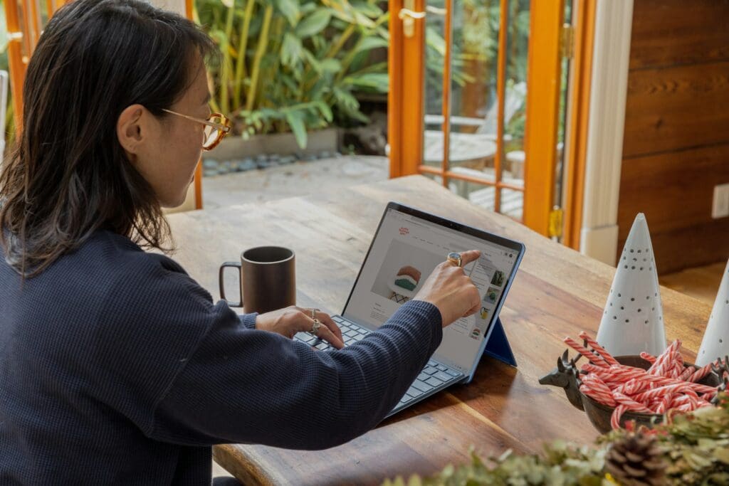 Transform Your Business in 2025 with our Small Business Management Consulting Services 6 Woman using a laptop for Small Business Management Consulting. Document Review. Review of a document