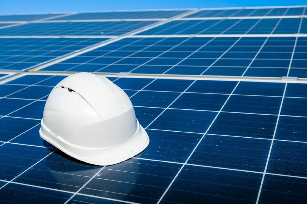 Construction Lawyers | Blaze Business & Legal 5 A white hard hat sitting on top of a bank of solar panels. Construction Lawyers. AS2124-1992. AS2124