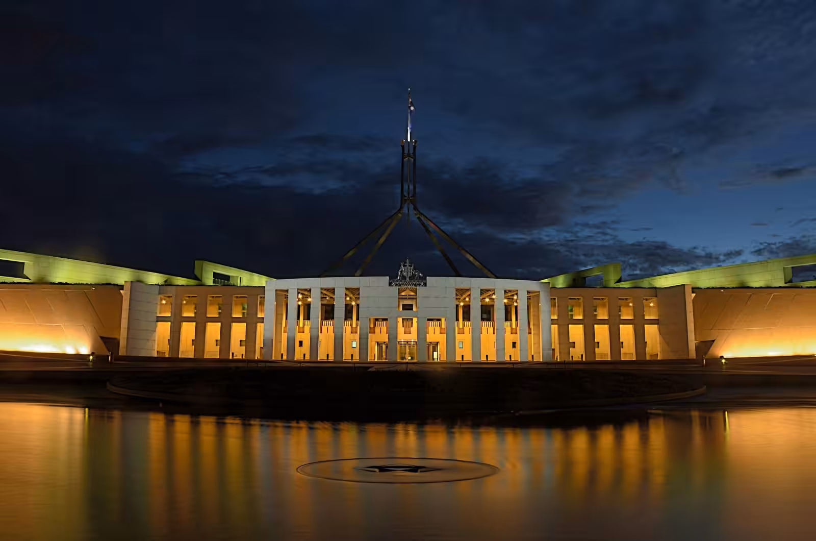 White concrete government building near body of water. Construction Law. Understanding conflicts of interest?
