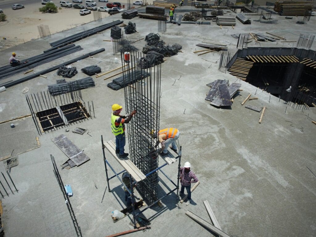 Construction Law 9 Workers standing on top of a construction site. Construction Law. Blaze Business & Legal