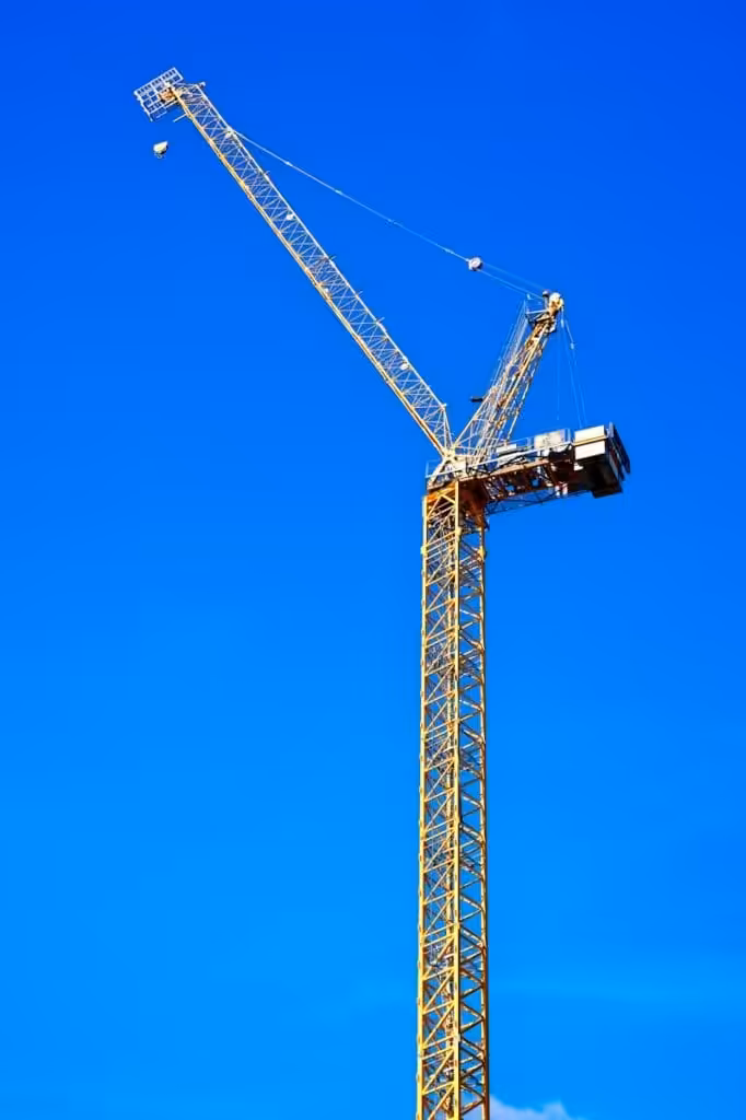 A tall crane with a blue sky. Construction Contract. Construct Only. AS2124-1992. AS2124