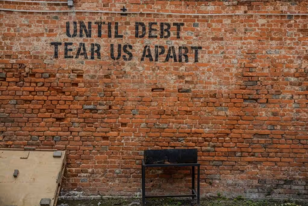 Until debt tear us apart printed red brick wall. Business Loan Calculator