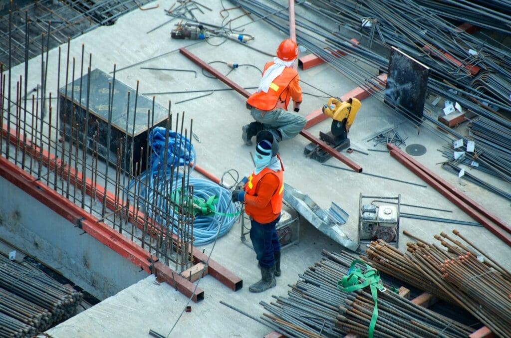 Building Construction Lawyer: Expert Legal Support for Your Construction Business 1 Men working at a construction site. Construction Lawyer. Building Construction Lawyer