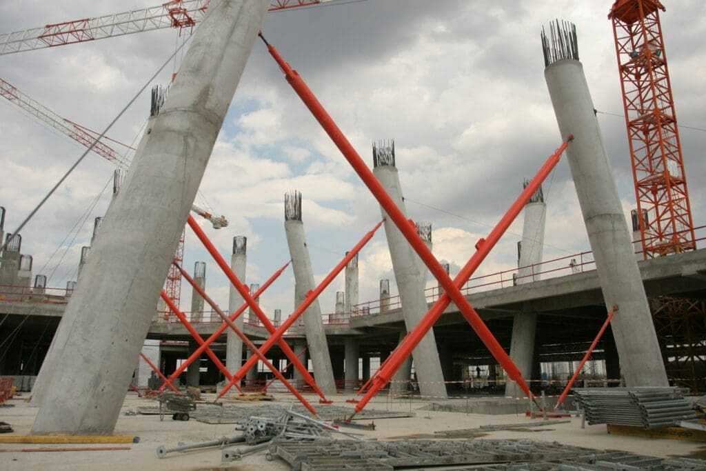 Construction Law 7 A construction site with a crane and a building in the background. Construction Law. Construction and Contracting