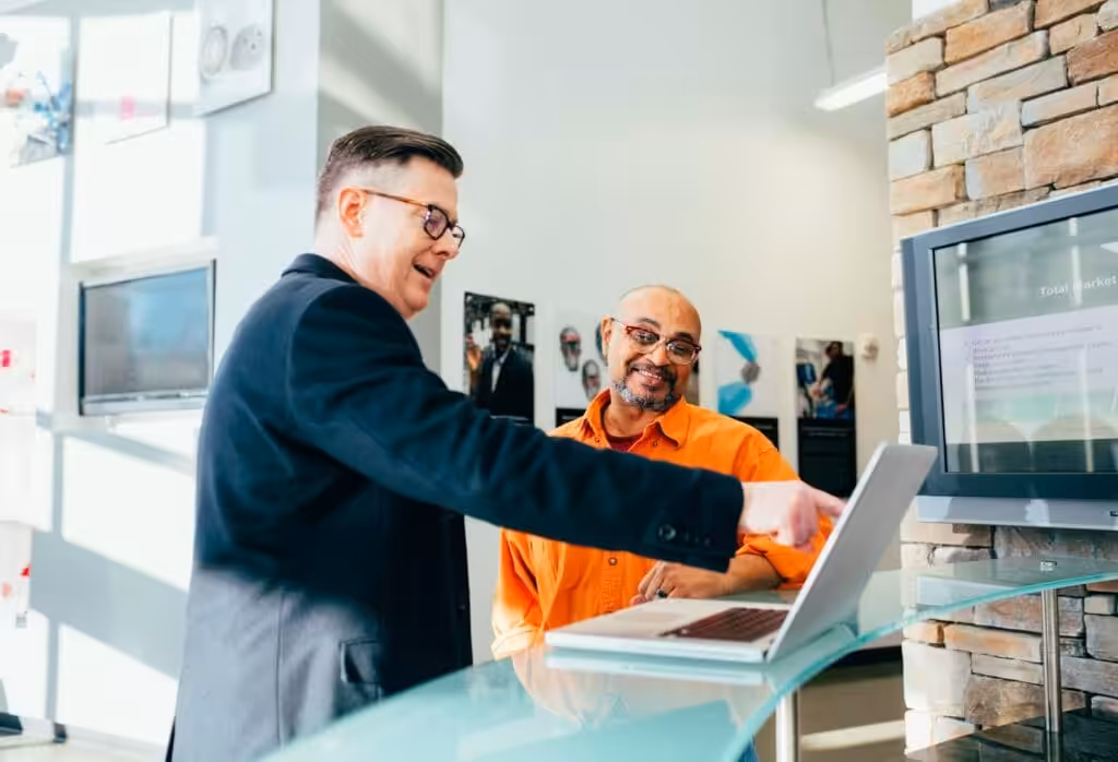 Business owner speaking to a banker. Business Loan Calculator