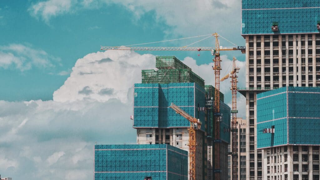 How to Review a Construction Contract 5 Cranes around a building under construction. How to review a construction contract. How to review a construction agreement.