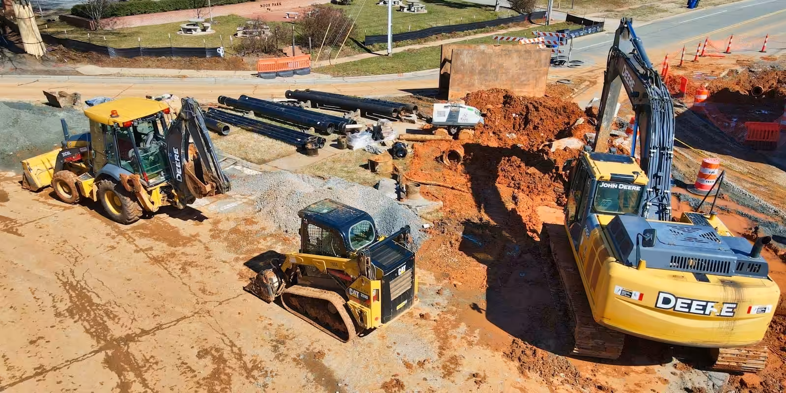 Earthmoving equipment at a construction site. How to review a construction contract.