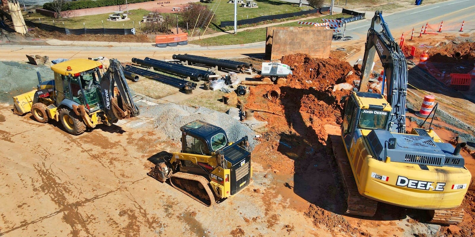 Earthmoving equipment at a construction site. How to review a construction contract.