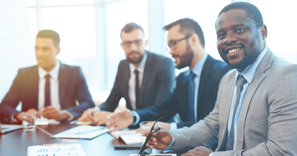 4 businessmen at a meeting with Blaze Business & Legal. Business Services