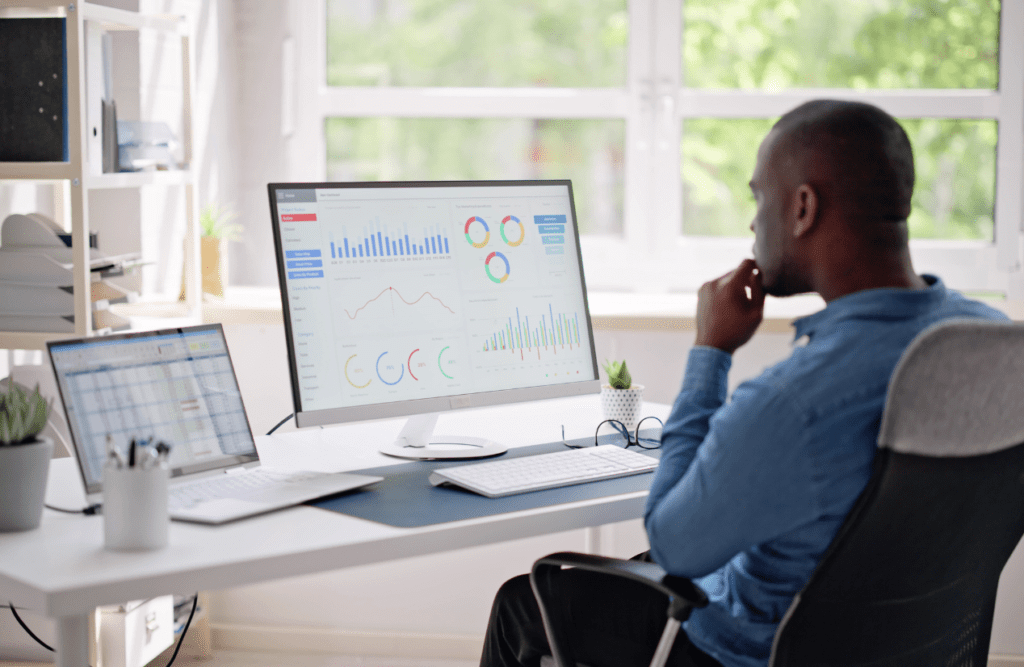 Leveraging Business Advice for Growth and Success (Our 10-point Roadmap in 2025) 2 Business person reviewing analytics on computer. Business Advice