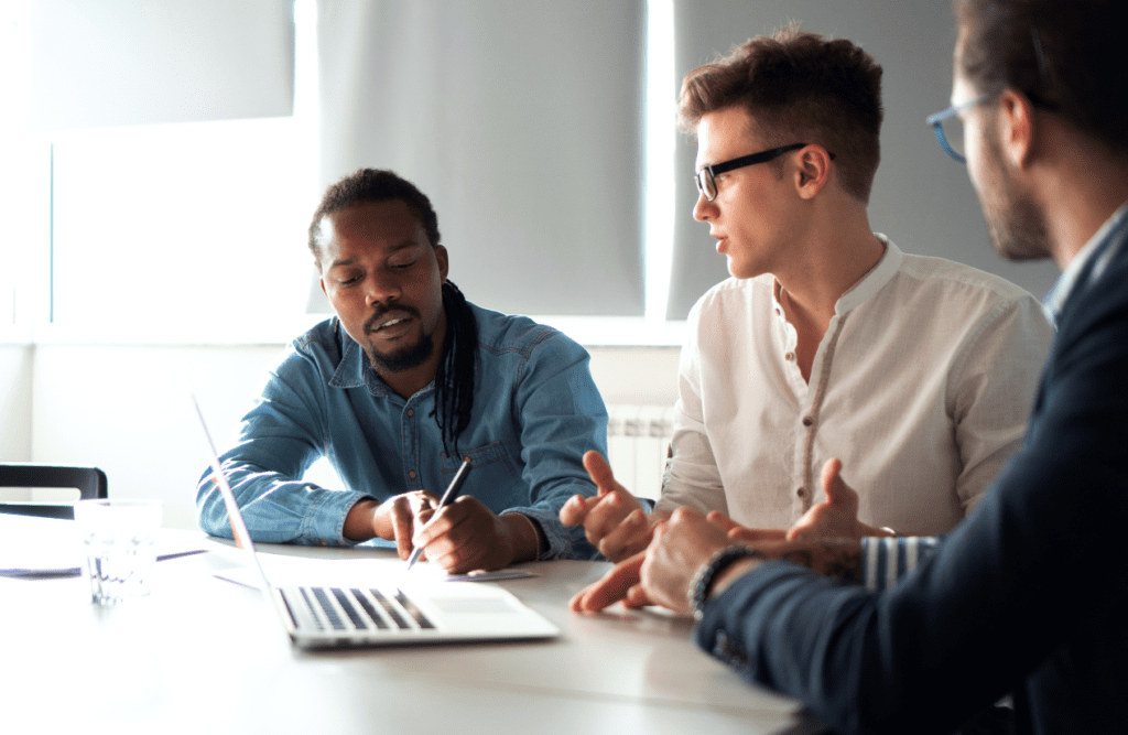 Leveraging Business Advice for Growth and Success (Our 10-point Roadmap in 2025) 4 Three business professionals discussing on finding the right advisor. Business Advice