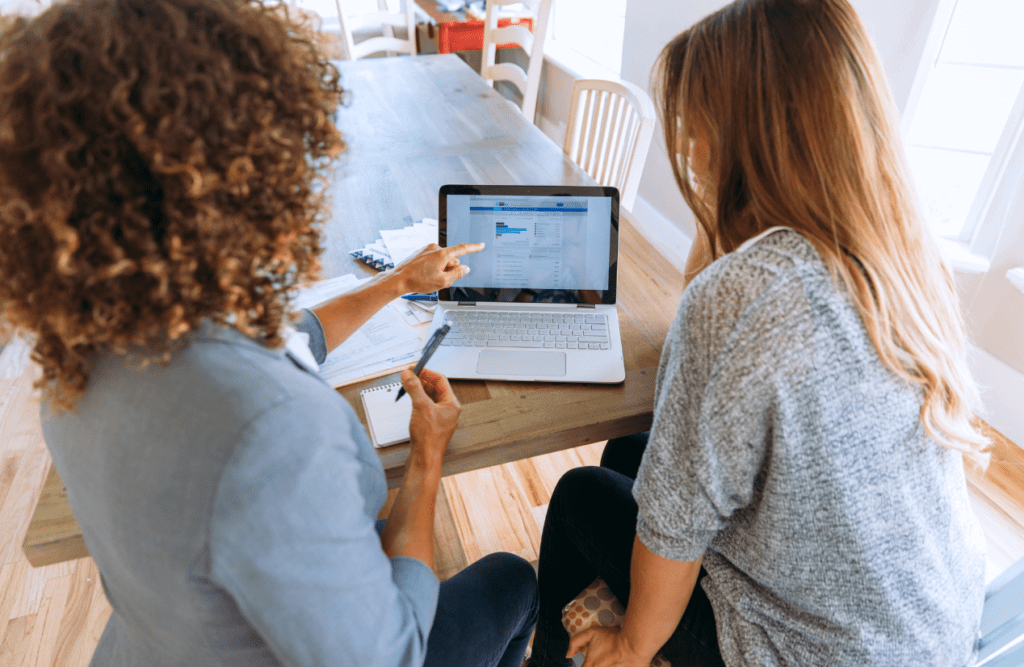 How our Contract Review Lawyer can save you money 4 Business advisor and client are reviewing data on a laptop screen. Business Advice. Contract Review Lawyer