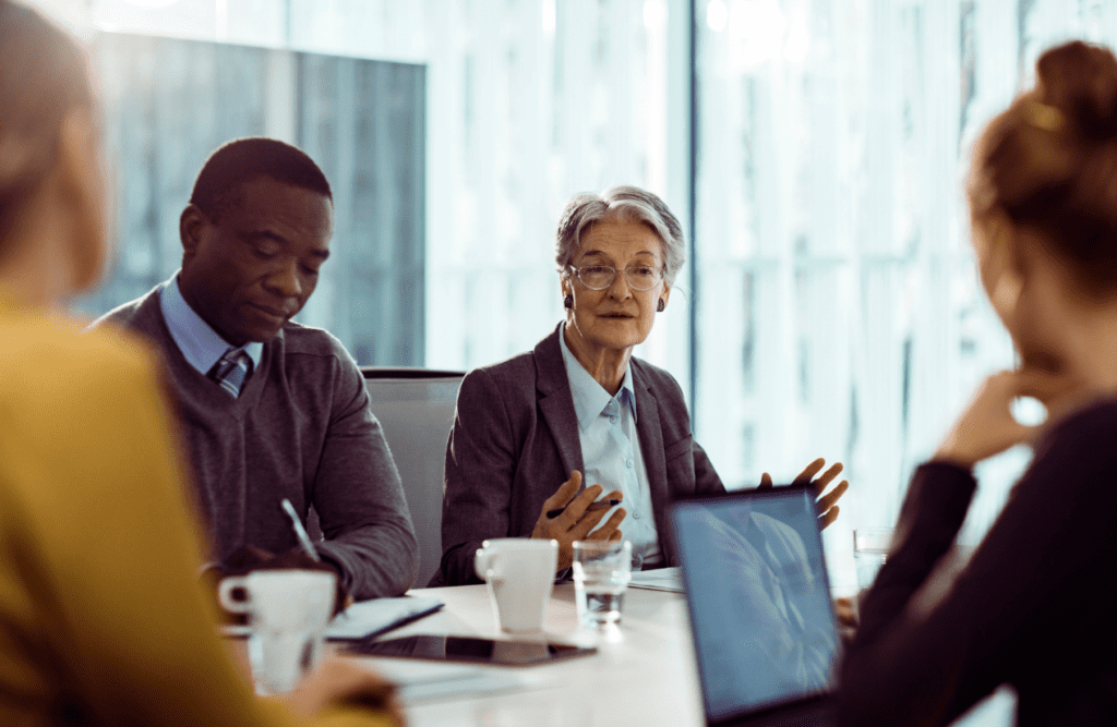 How our Contract Review Lawyer can save you money 6 Group of business people having a meeting in the office. Business Advice. Contract Review Lawyer