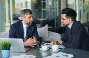 Two business professionals having a discussion. Business Advice. Contract Review Lawyer. Management Consulting Industry