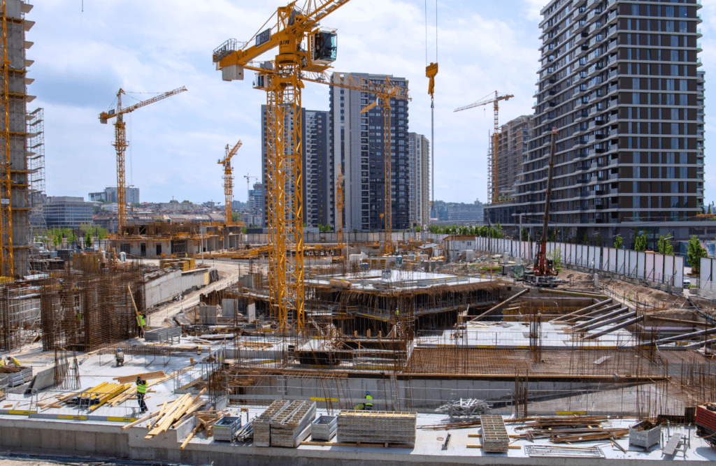 Construction site surrounded by high-rise buildings. Risk Management in Construction Projects. Construction and Contracting