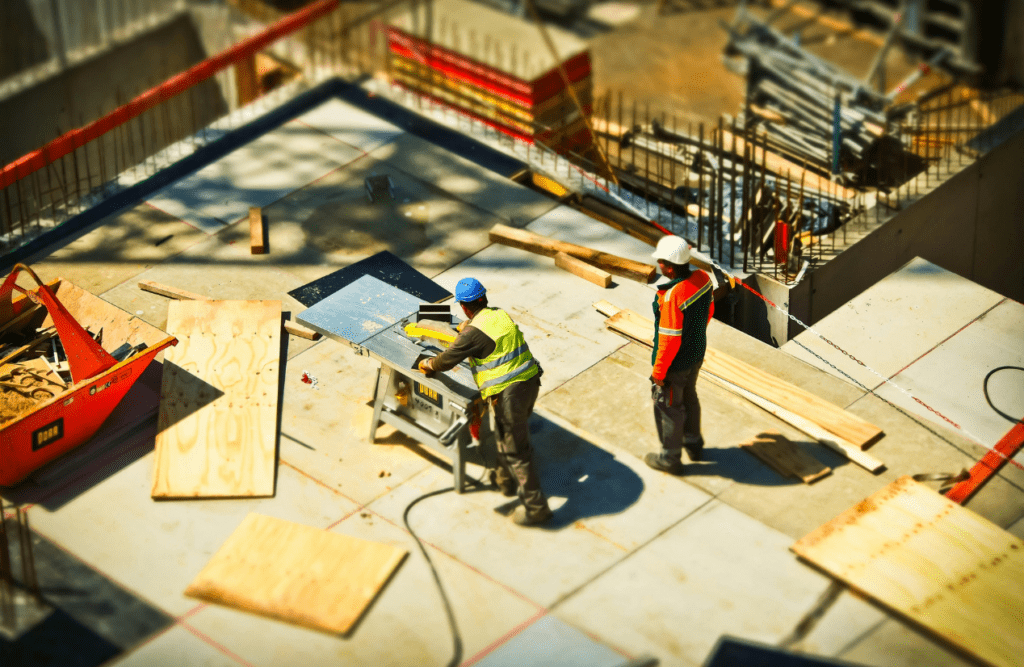 Two men on construction site during daytime. Risk Management in Construction Projects