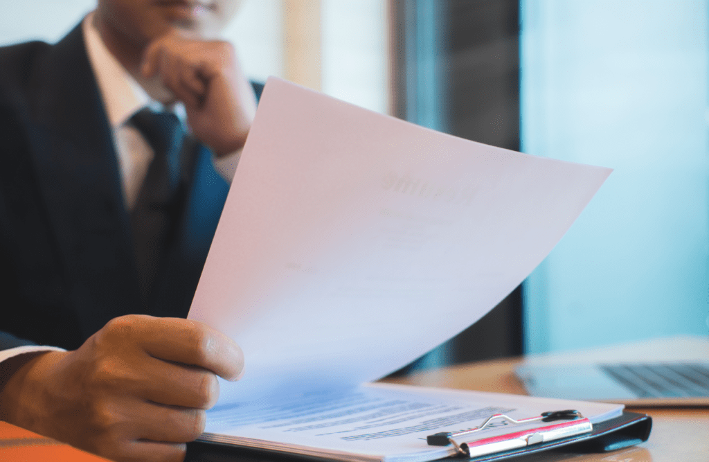 Blaze Business & Legal - How to Review a Contract 1 Businessman reviewing a contract at the office. How to Review a Contract