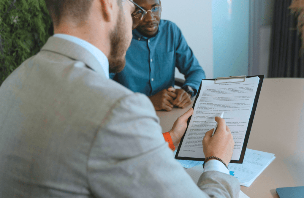 Blaze Business & Legal - How to Review a Contract 2 Man reading a contract. How to Review a Contract