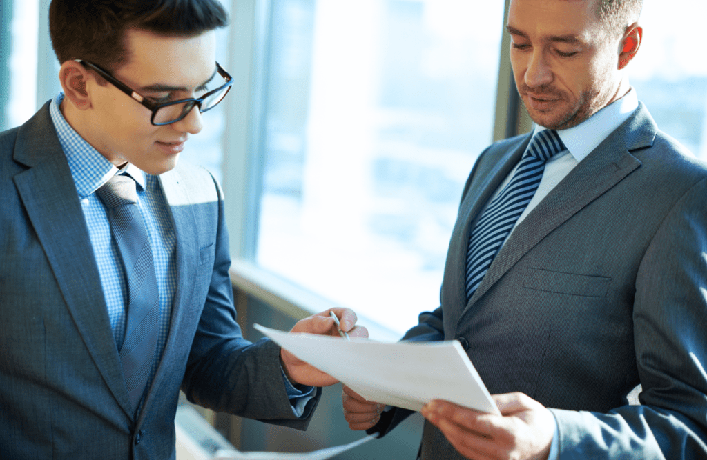 How our Contract Review Lawyer can save you money 7 Two businessmen reviewing a contract. How to Review a Contract. Contract Review Lawyer