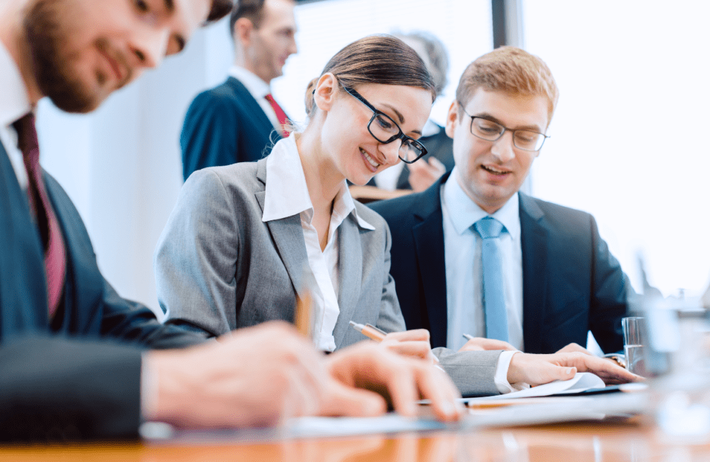 How our Contract Review Lawyer can save you money 3 Group of business professionals gathered to discuss a contract. How to Review a Contract. Contract Review Lawyer