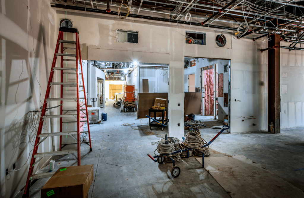 Your Design and Construct Contract Explained – How the D&C Contract Model Works in Australia 6 An unfinished interior construction. Design and Construction Contracts