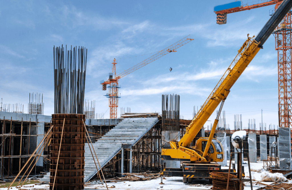Construction Contract Review | Get Expert Legal Insights & Protect your Building Company 2 A construction crane at work on a construction site. Design and Construction Contracts. Construction Contract Review.
