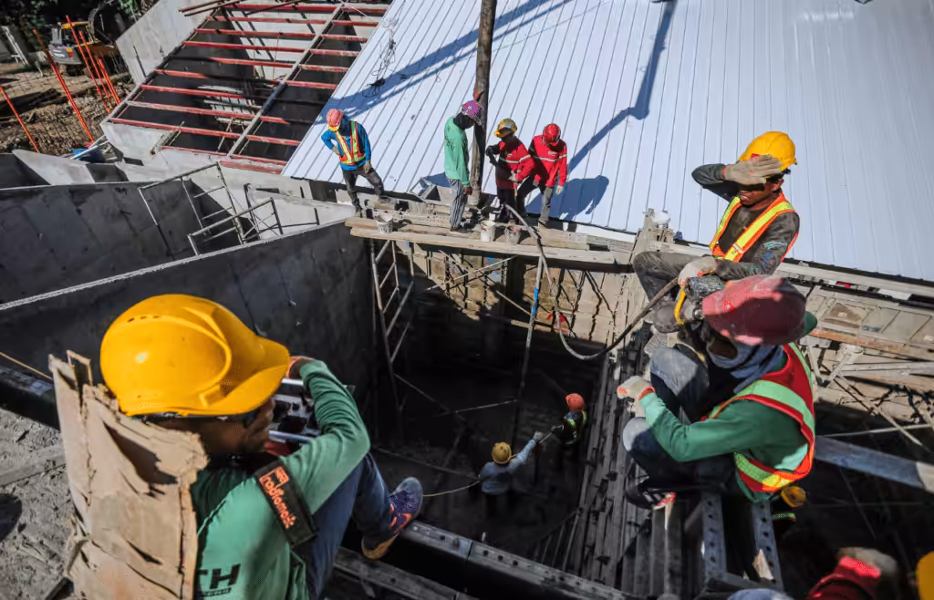 Men working on a construction site. DLP Meaning. Constrution and Contracting