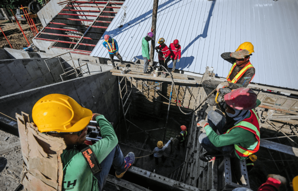 DLP Meaning – What is the Defects Liability Period in Construction? 2 Men working on a construction site. DLP Meaning. Constrution and Contracting