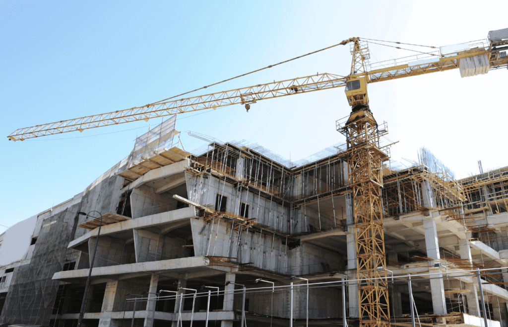 DLP Meaning – What is the Defects Liability Period in Construction? 5 A large building under construction, with a crane lifting materials. DLP Meaning
