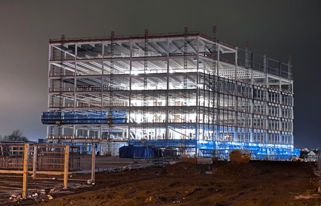 DLP Meaning – What is the Defects Liability Period in Construction? 12 A large building under construction at night. DLP Meaning