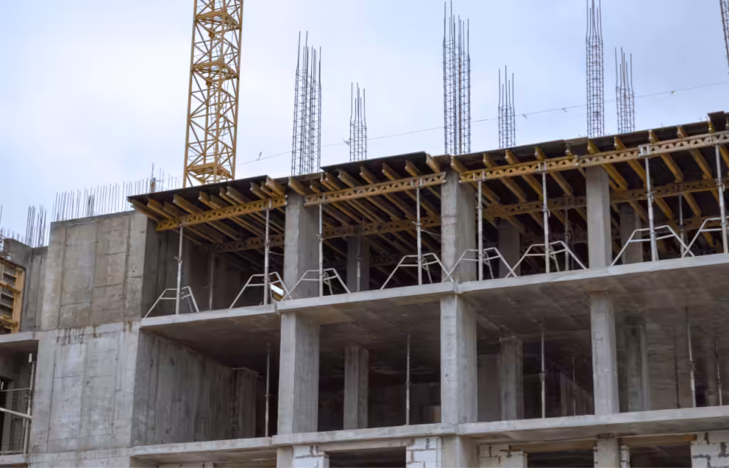 An under-construction building with a steel and concrete structure. DLP Meaning