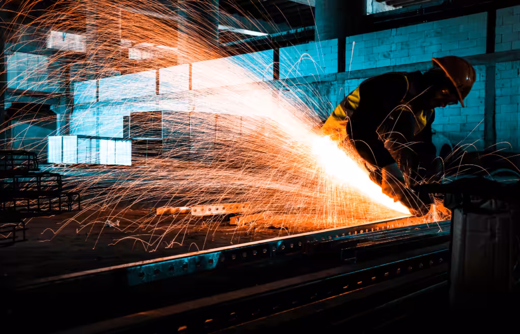 Construction worker welding a metal. DLP Meaning