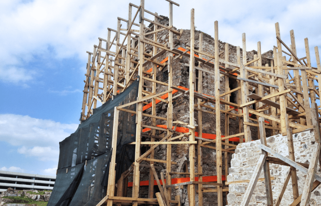 DLP Meaning – What is the Defects Liability Period in Construction? 16 A building under construction with wooden scaffolding. DLP Meaning