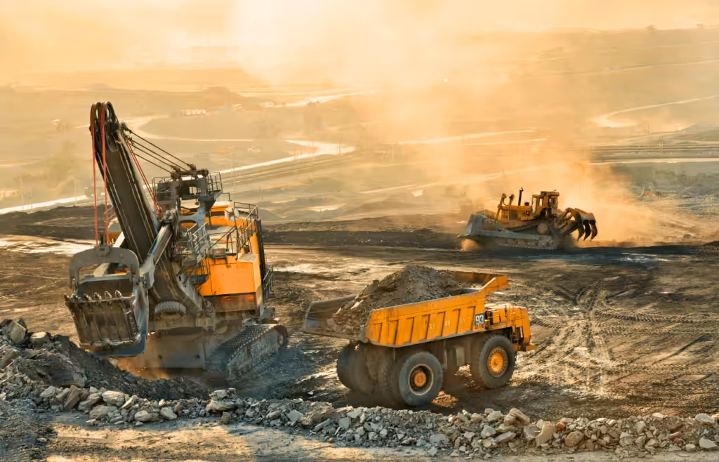 Excavator and dump truck are removing rocks from the site. Latent Conditions. Construction and Contracting