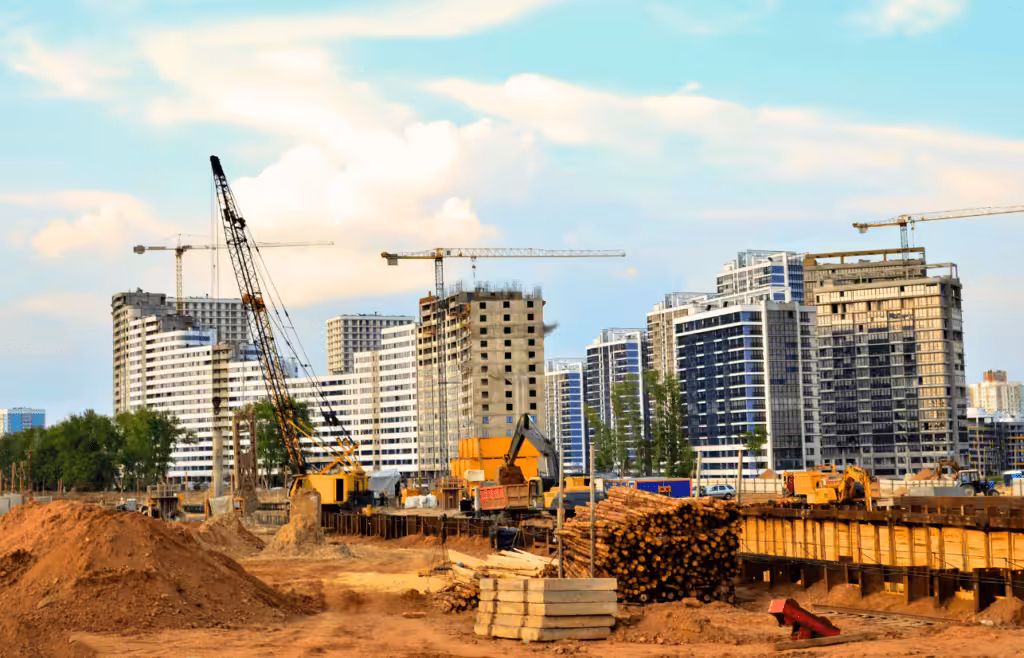 Construction site with towering cranes and heavy machinery. Latent Conditions. Consultant Brisbane
