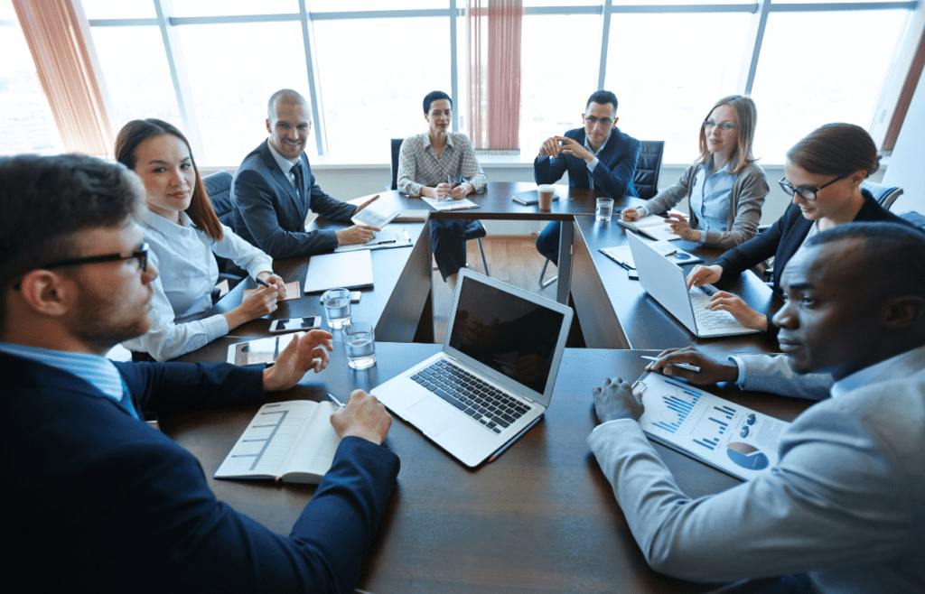 Business individuals participating in a meeting. Management Consulting Companies Australia