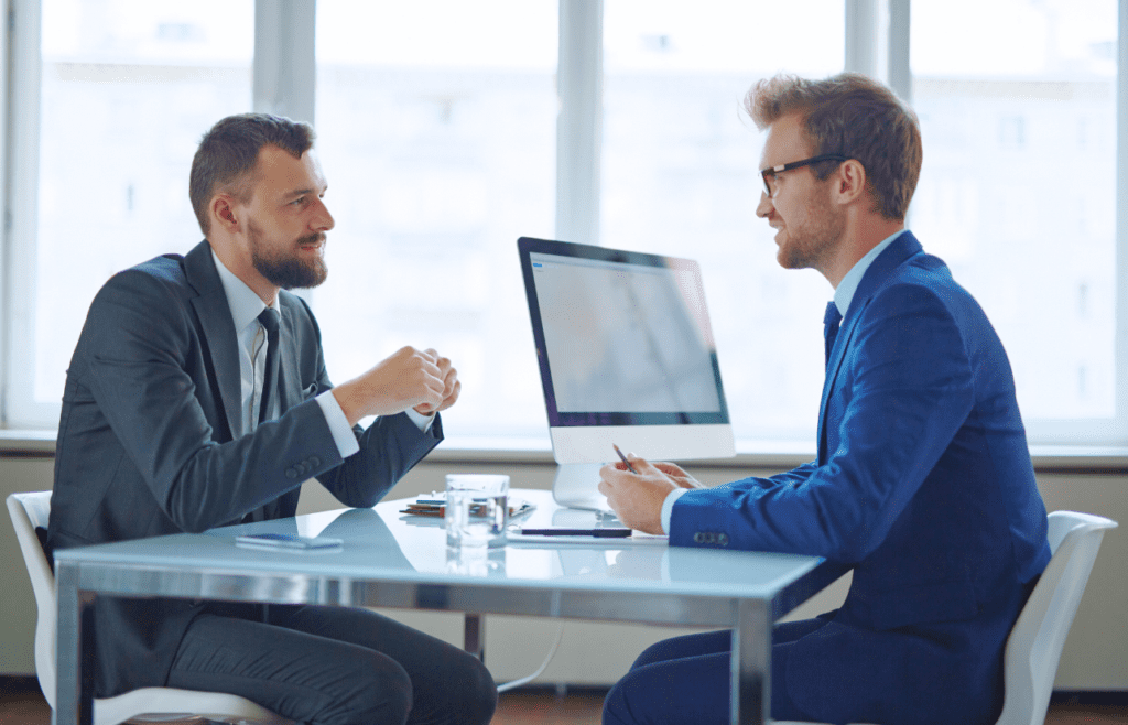 Client and Management Consultant / Solicitor discussing business. Management Consulting Companies Australia. Management Consulting Professional. Solicitor Brisbane
