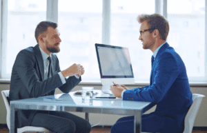Client and Management Consultant / Solicitor discussing business. Management Consulting Companies Australia. Management Consulting Professional. Solicitor Brisbane