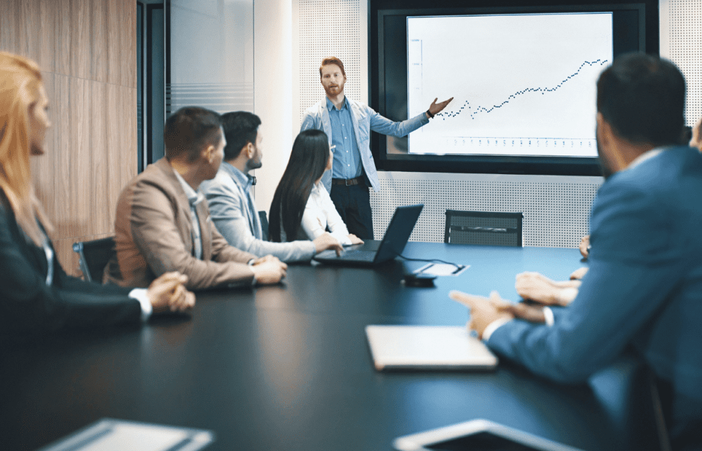 What is the Management Consulting Industry – A Practical Guide for Australian Businesses 6 Man delivers a presentation in front of clients. Managment Consulting Industry