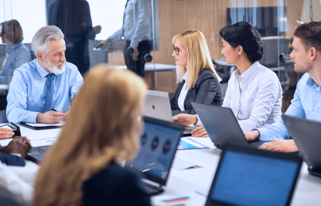 What is the Management Consulting Industry – A Practical Guide for Australian Businesses 12 Business people collaborating ideas during meeting. Managment Consulting Industry