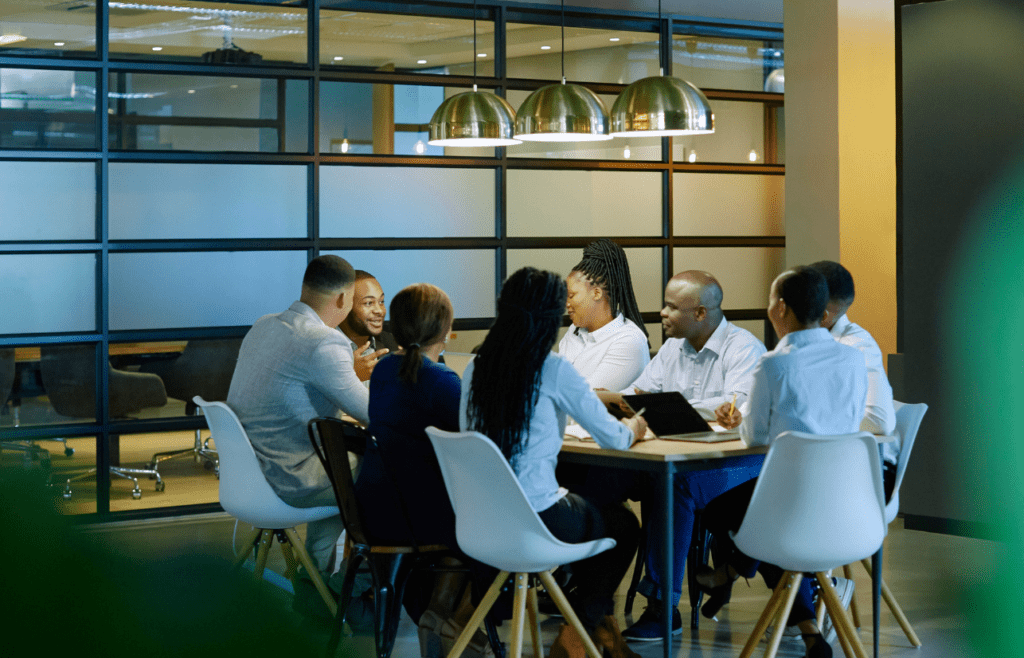 What is the Management Consulting Industry – A Practical Guide for Australian Businesses 13 Business people gathered for a board meeting. Managment Consulting Industry