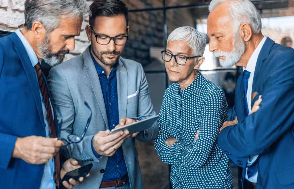 Business people looking at a tablet Management Consulting and Strategy Consulting. Consultant Brisbane